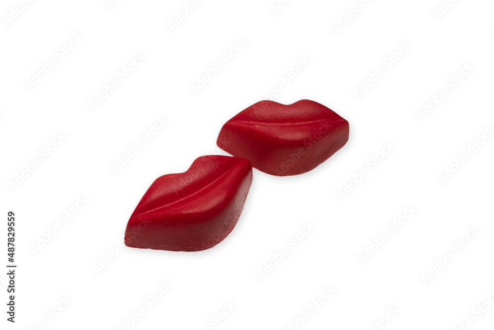 Fototapeta premium Red lips candy chocolate on a white background.