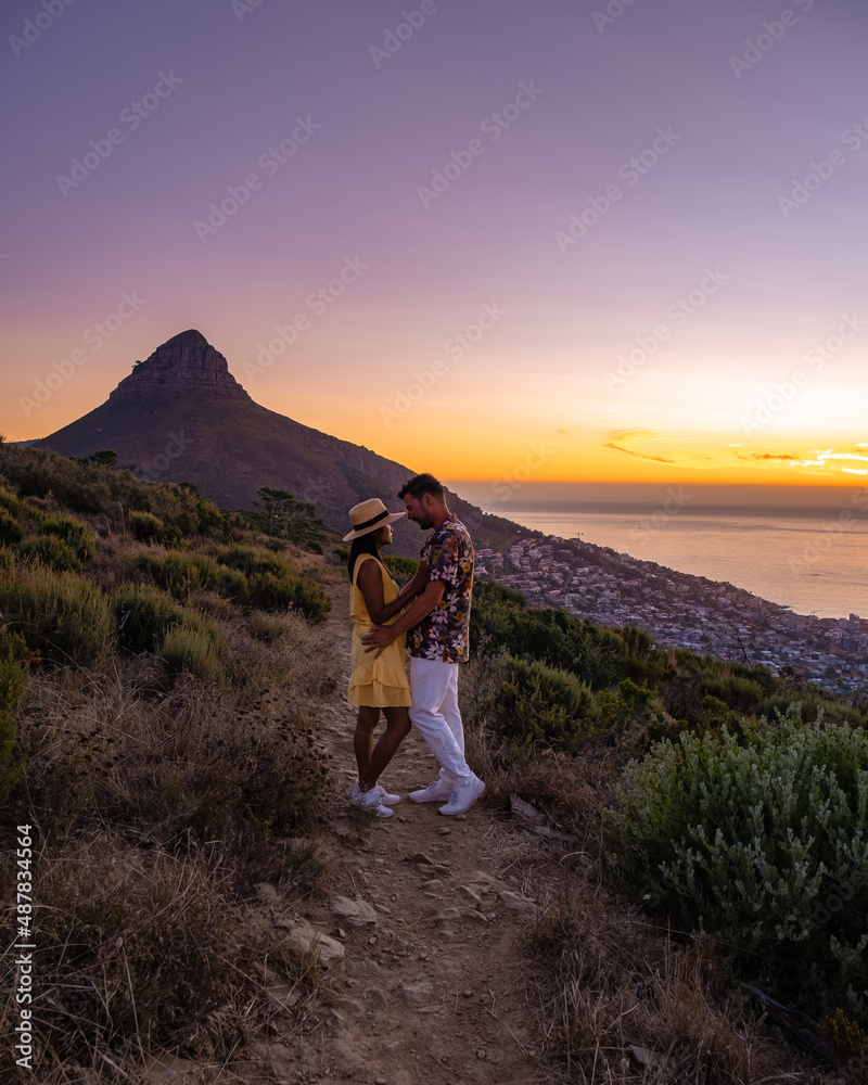 A person standing on top of a hill at sunset photo – Free Cape town Image  on Unsplash
