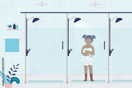Little girl bathes after workout in public shower. Public bathroom interior design. Child soaping himself with gel in shower cabin