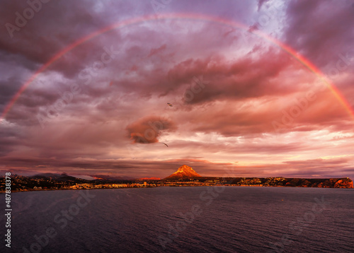 Sunset in Javea with the rainbow, Alicante photo
