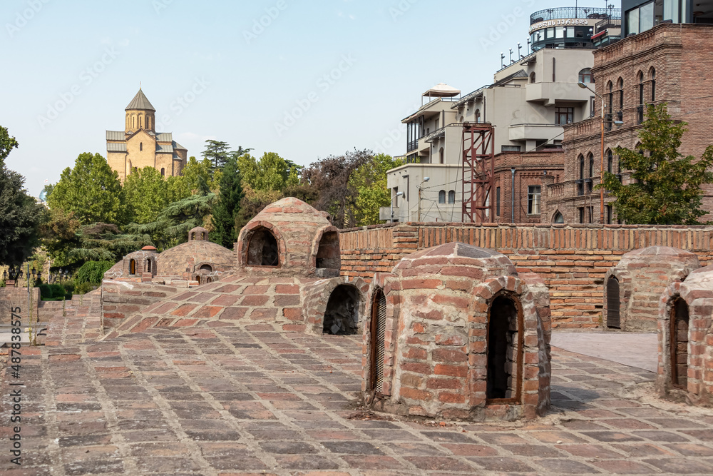 Domed roofs of sulfuric baths in the Abanotubani district of Tbilisi, the capital of Georgia. Royal baths. Luxury spa vacation. Relaxation Concept. Sulfur. Dome