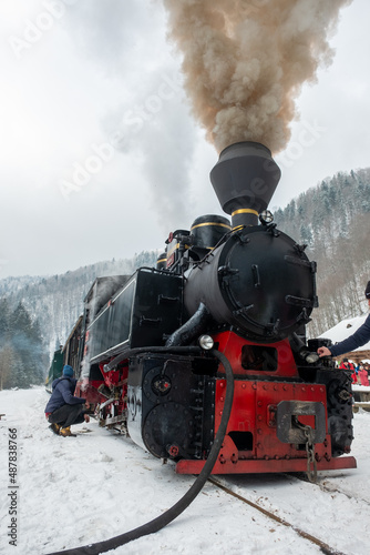 Steam train Mocanita on a railway station in winter, Romania