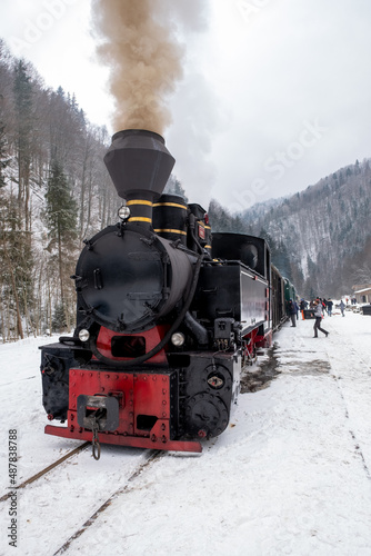 Steam train Mocanita on a railway station in winter, Romania