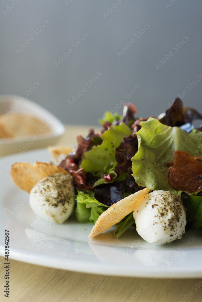 Green and purple lettuce salad. Arugula and pieces of casabe. Healthy food. Green and purple lettuce salad. Arugula and pieces of casabe. Healthy food.