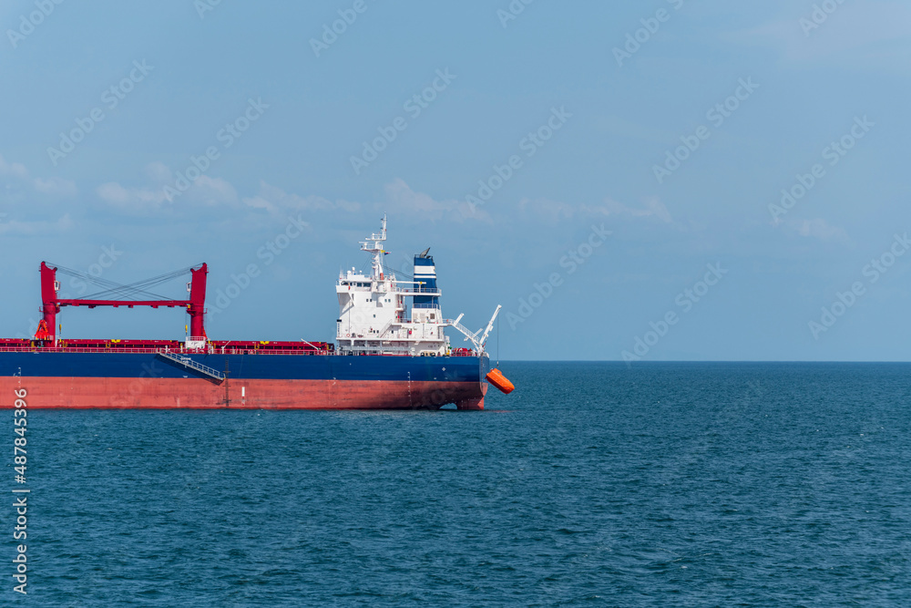 Lowering and Maneuvering orange free fall lifeboat in water. Abandon ship drill. Lifeboat training. Lowering and Maneuvering orange free fall lifeboat in water. Abandon ship drill. Lifeboat training.