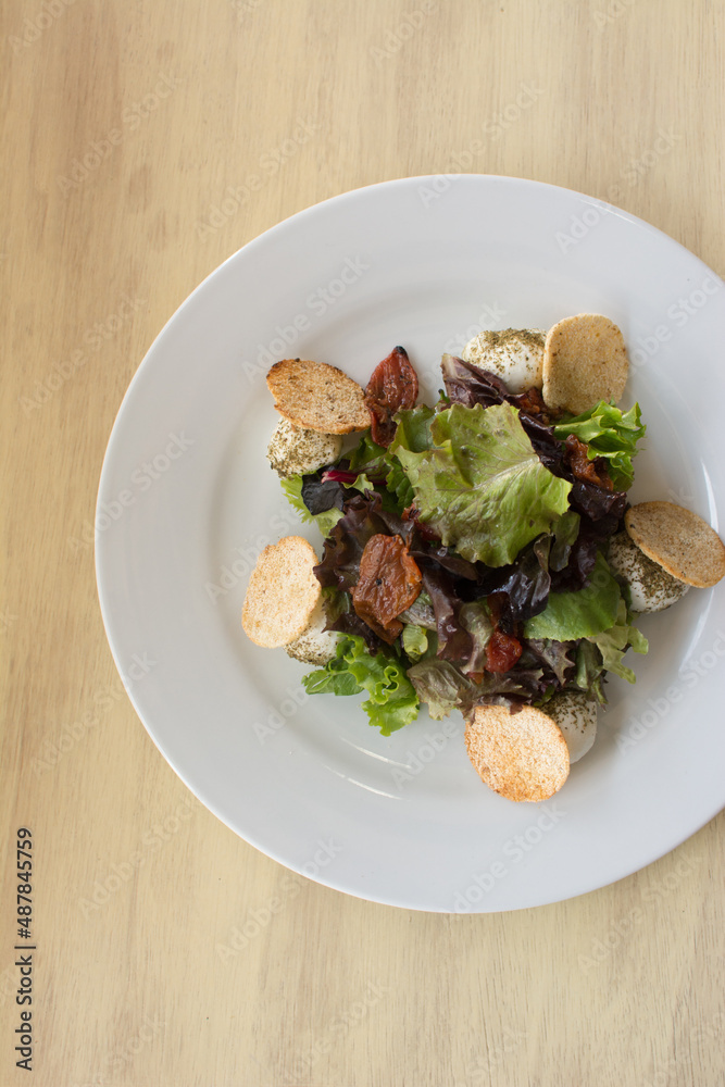 Green and purple lettuce salad. Arugula and pieces of casabe. Healthy food. Green and purple lettuce salad. Arugula and pieces of casabe. Healthy food.