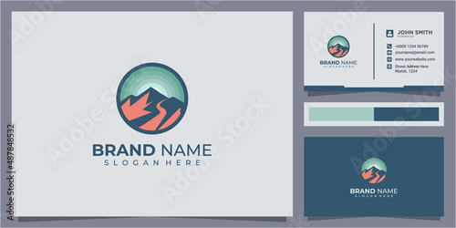 Sunset above mountains peak silhouette. Vintage styled mountain logo
