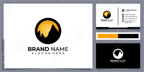 Sunset above mountains peak silhouette. Vintage styled mountain logo or sticker