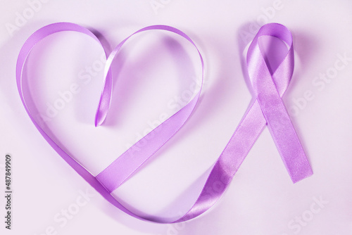 March lilac. Cervical Cancer Awareness Month. Heart shaped lilac ribbon.