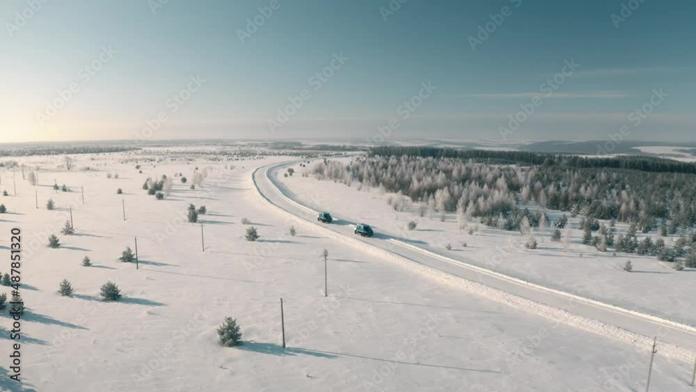 a Specialized car of the emergency utility service in the winter road. a Specialized car of the emergency utility service in the winter road.
