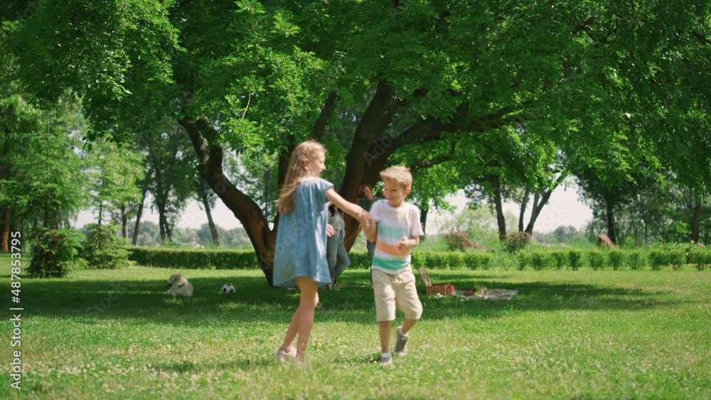Children have fun playing active games on nature. Happy family leisure concept. Children have fun playing active games on nature. Happy family leisure concept.