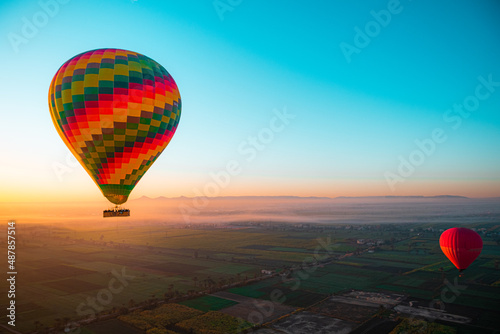 Amazing view of a bright vibrant baloon at sunrise. Balloon rides in luxor, view of egypt. Famous in cappadoccia as well, thrill of the ride popular with tourists