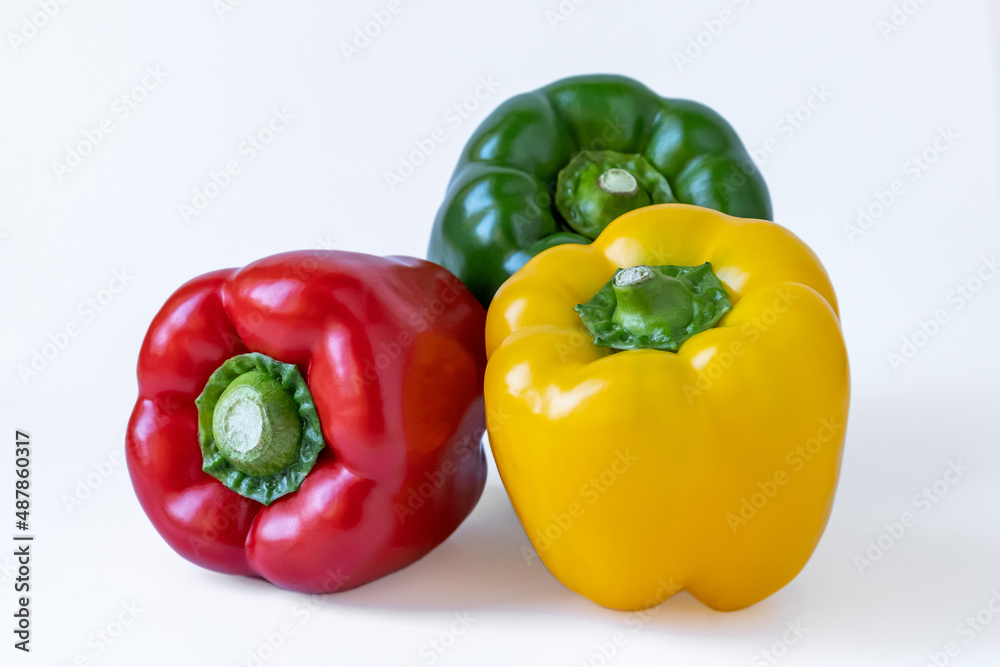Closeup of colorful peppers, white background. Closeup of colorful peppers, white background.