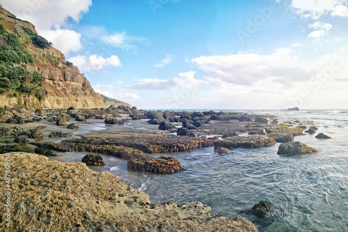 A beautiful shot of a seascape taken in Maukatia Bay, Muriwai, Auckland photo