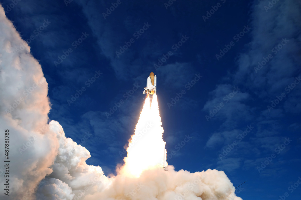 Take off space rocket on a background of blue sky and sun. Elements of this image were furnished by NASA