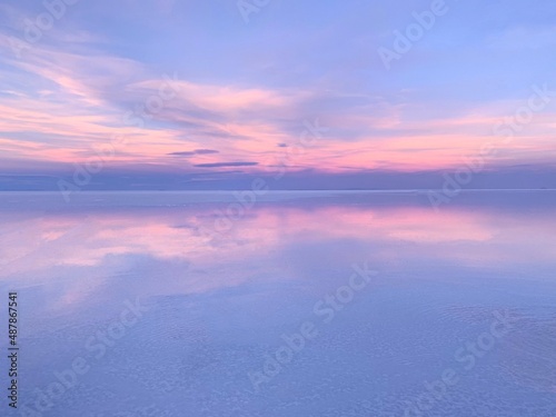 Beautiful lilac sky sunset over water. 