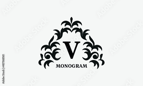 Elegant floral logo design template for letter V. Calligraphic dark elegant ornament on a light background. Business sign, identity monogram for restaurant, boutique, hotel, heraldic, jewelry.