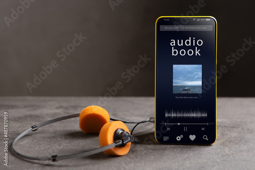 Streaming service. Listen audiobook online concept, online music player app on smartphone photo