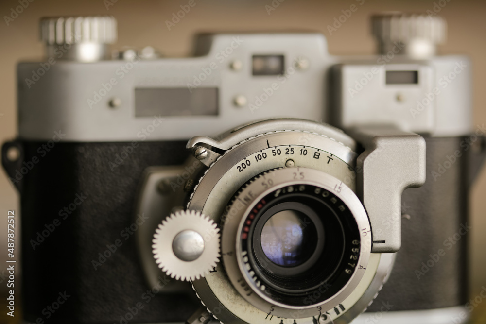 Vintage old photography film camera with lens. Close up macro shot