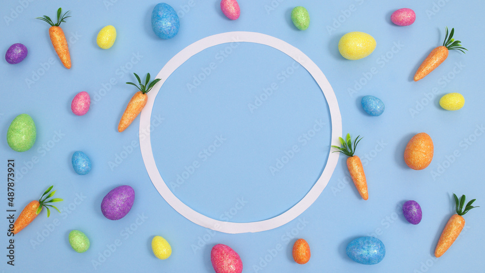 Easter background pattern with colorful eggs and circle frame on pastel blue theme. Flat lay creative copy space Easter background pattern with colorful eggs and circle frame on pastel blue theme. Flat lay creative copy space