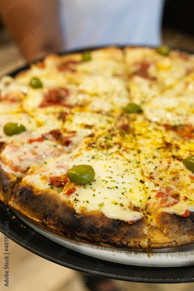 mozzarella pizza with green olives