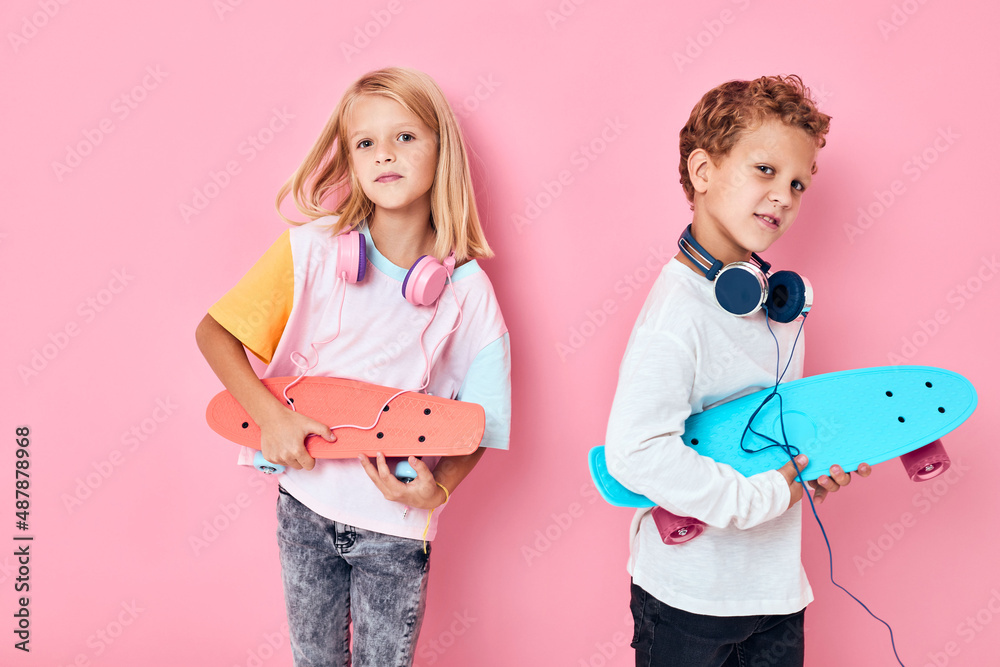 Children with skateboard in hands entertainment lifestyle Children with skateboard in hands entertainment lifestyle