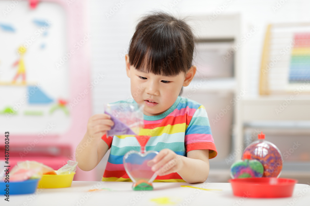 young girl making sand crafts for home schooling young girl making sand crafts for home schooling
