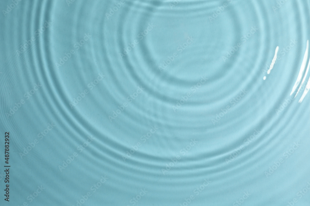 Closeup view of water with circles on turquoise background Closeup view of water with circles on turquoise background