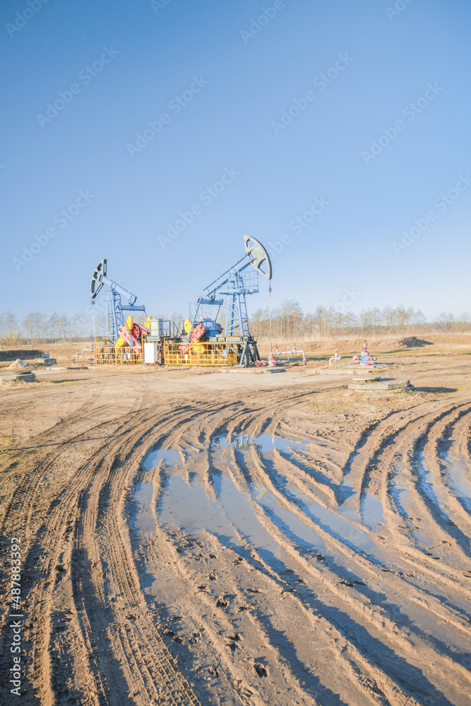 Fototapeta premium Oil pump on the background of blue sky