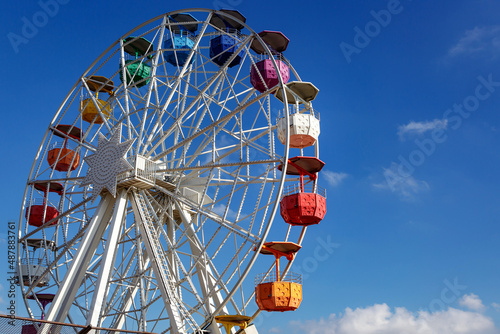 Ferris Wheel Over Blue Sky.