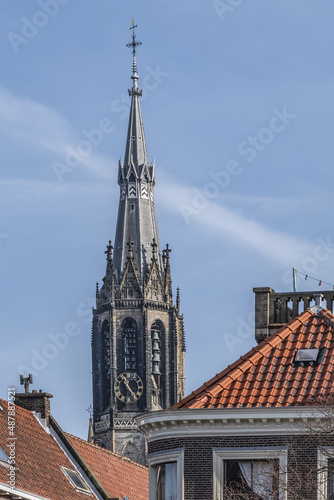 View of XV century Belfry of Nieuwe Kerk (New Church, 1396 - 1496) on Market square in Delft. New Church, with 108,5 m church tower - second highest church in the Netherlands. Delft.