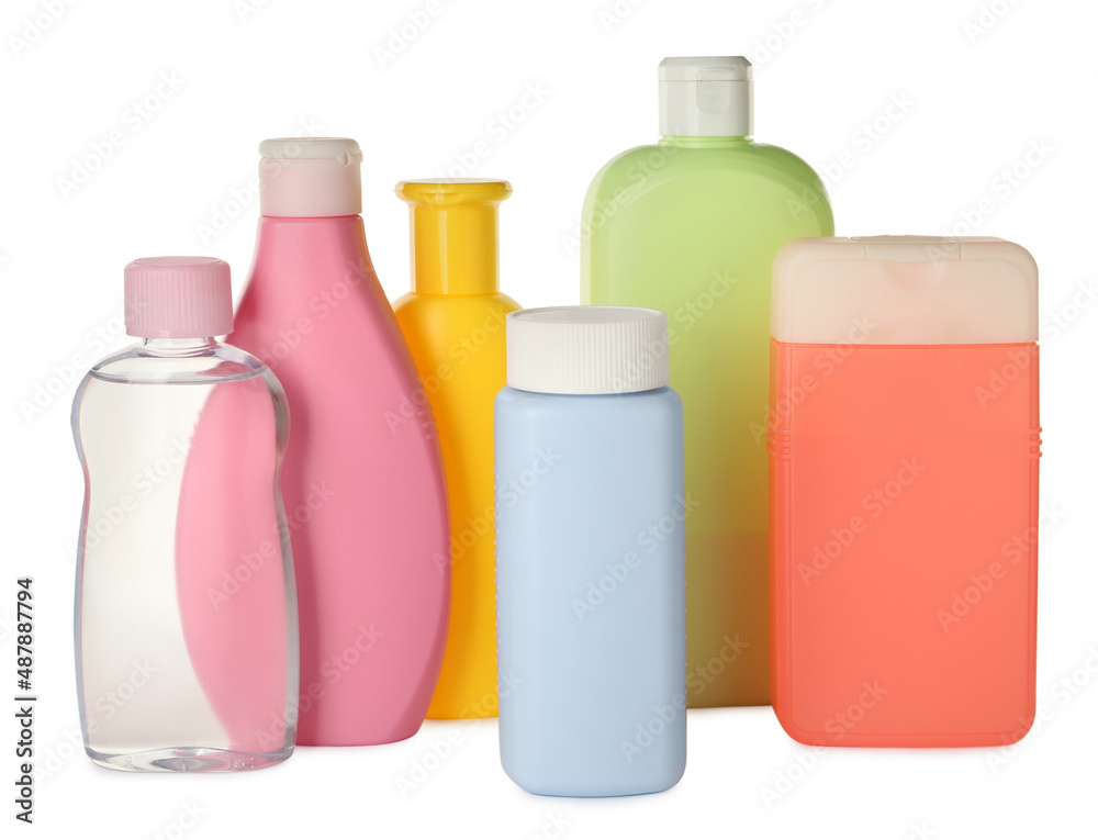 Bottles of baby cosmetic products on white background
