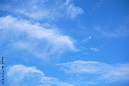 Waxing gibbous moon with the blue sky and cirrus clouds on the Mississippi Gulf Coast