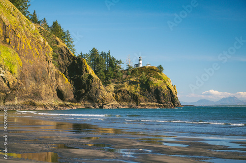 Lighthouse on a cliff over the ocean at Cape Disappointment