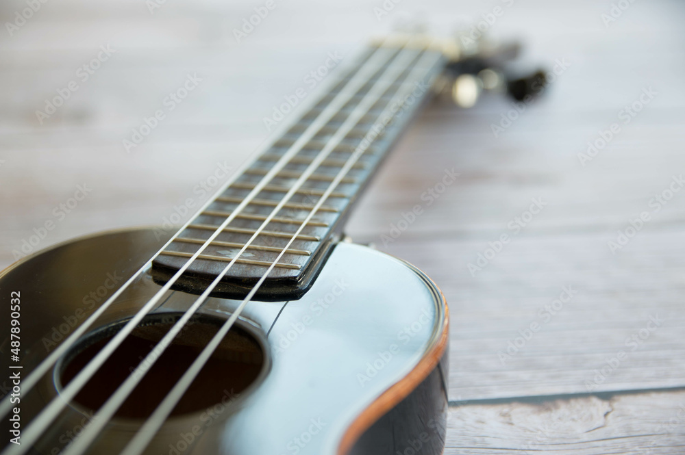 Ukulele black musical instrument close up Ukulele black musical instrument close up