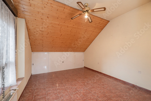 Wallpaper Mural Bedroom with sloping ceiling covered with pine wood and fan lamp with colored terrazzo floors Torontodigital.ca