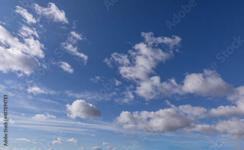 Sidelit White Clouds with Blue Sky for Sky replacements and backgrounds