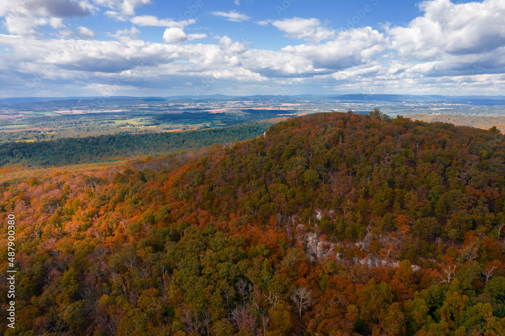 Aerial Drone View of Fall Forest With Foliage Amongst Blue Cloudy Skies Aerial Drone View of Fall Forest With Foliage Amongst Blue Cloudy Skies