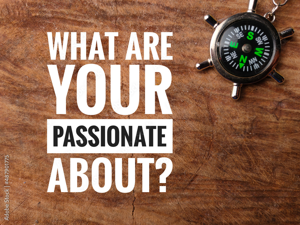 Top view compass with text WHAT ARE YOUR PASSIONATE ABOUT? on wooden background. Top view compass with text WHAT ARE YOUR PASSIONATE ABOUT? on wooden background.