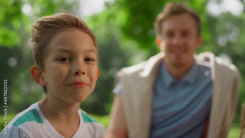 Eating boy smiling on camera on picnic closeup. Portrait of funny kid on nature Eating boy smiling on camera on picnic closeup. Portrait of funny kid on nature