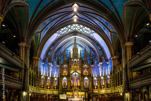 Architectural detail of Notre-Dame Basilica, a basilica in the historic district of Old Montreal. Its dramatic interior is considered a masterpiece of Gothic Revival architecture © Mltz