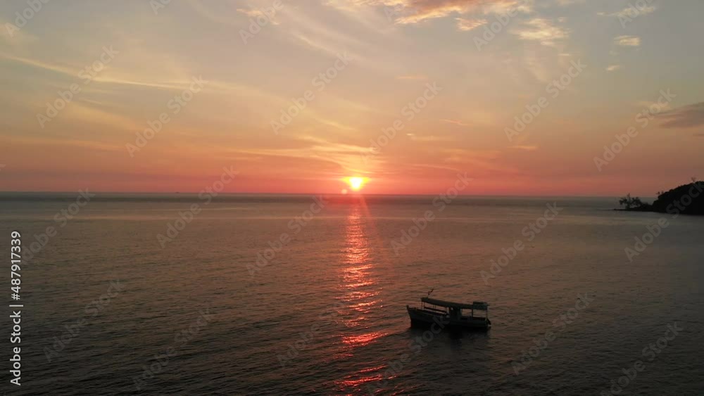 Boat or ship during beautiful sunset, Koh Rong island, Cambodia, aerial drone view Boat or ship during beautiful sunset, Koh Rong island, Cambodia, aerial drone view