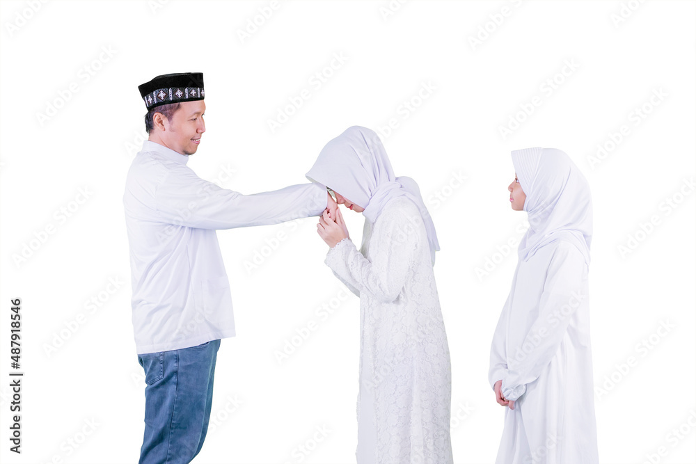 Man handshaking with his family during Eid Mubarak Man handshaking with his family during Eid Mubarak