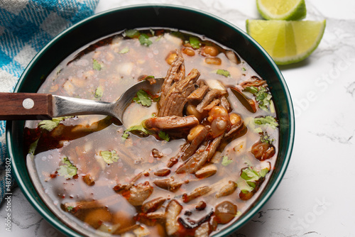 Beef birria consomme with chickpeas. Mexican food