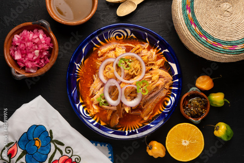 Cochinita pibil with habanero pepper and purple onion. Mexican food