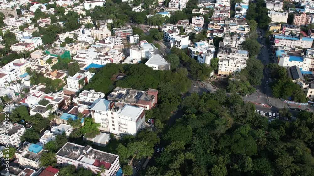 Aerial drone view of buildings, roads, and trees in the middle of Chennai city, India. Aerial drone view of buildings, roads, and trees in the middle of Chennai city, India.
