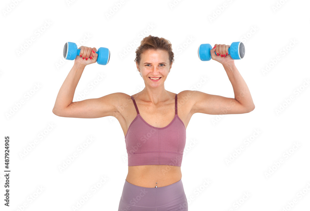 Young smiling woman exercising with dumbbells in hands isolated on white background Young smiling woman exercising with dumbbells in hands isolated on white background
