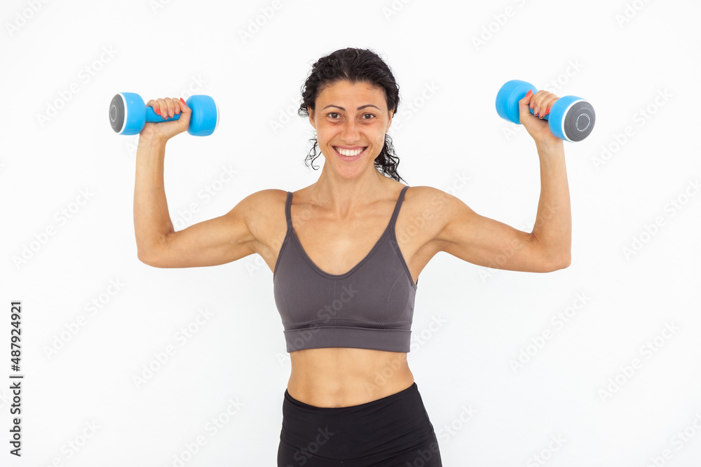 Image of smiling athletic woman with dumbbells isolated on white background Image of smiling athletic woman with dumbbells isolated on white background