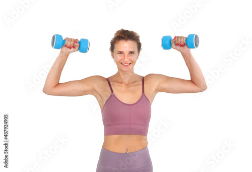 Young smiling woman exercising with dumbbells in hands isolated on white background