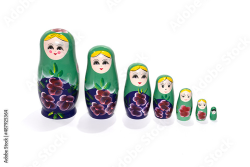 Bright green colored nesting dolls on a white background. Matryoshka.